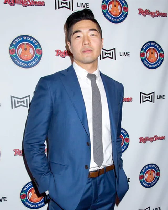 red carpet photo of man in suit