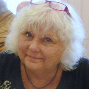 headshot of woman with white hair